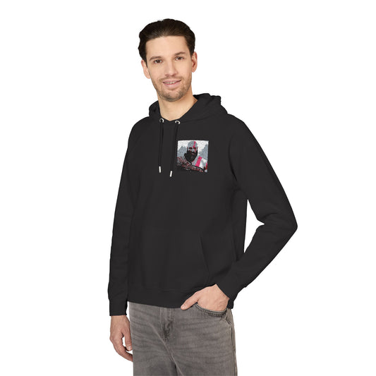 Man wearing a black hoodie with a graphic on the chest against a white background