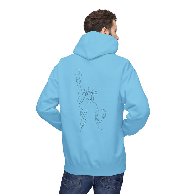 Person wearing a light blue hoodie with a graphic of the Statue of Liberty on the back, standing against a white background.