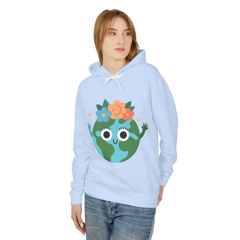 Person wearing a light blue hoodie with a cartoon Earth design on a white background