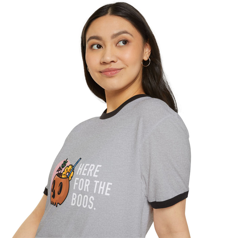 Woman wearing a gray t-shirt with a graphic and text on a white background