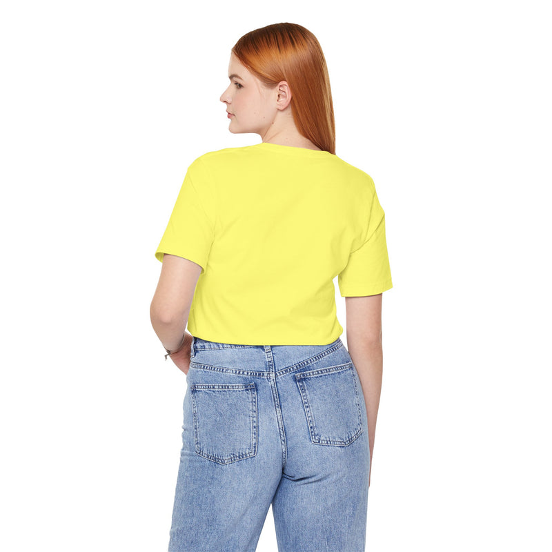 Person wearing a yellow t-shirt and blue jeans on a white background