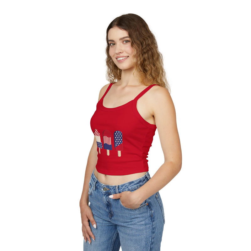 Woman wearing a red tank top with graphic design on a white background