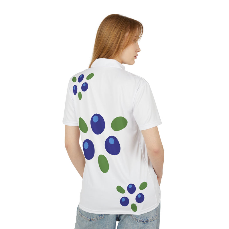 Person wearing a white shirt with blue and green abstract patterns on the back