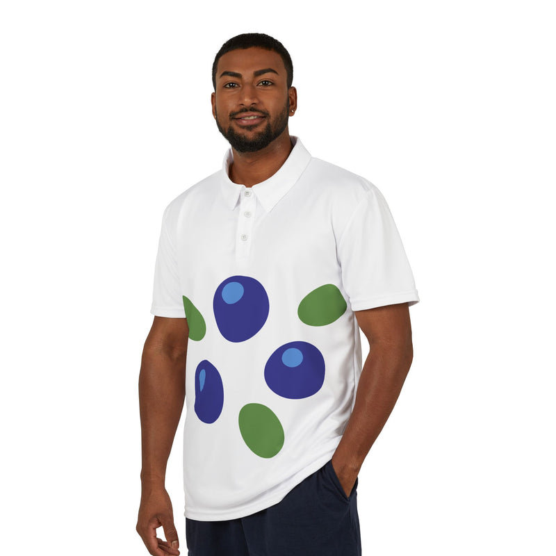 Man wearing a white polo shirt with blue and green abstract designs on a white background
